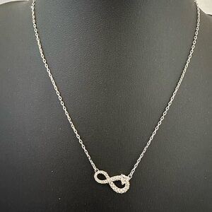 Swarovski silver tone crystal infinity necklace